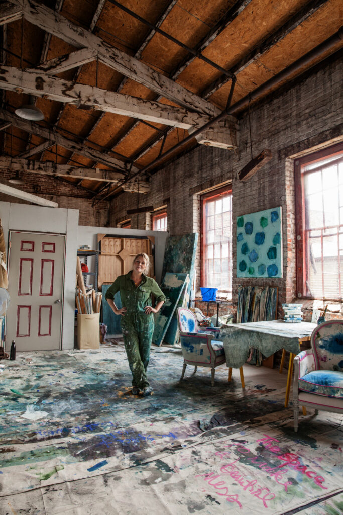 Kiki Slaughter standing in her spacious studio.
